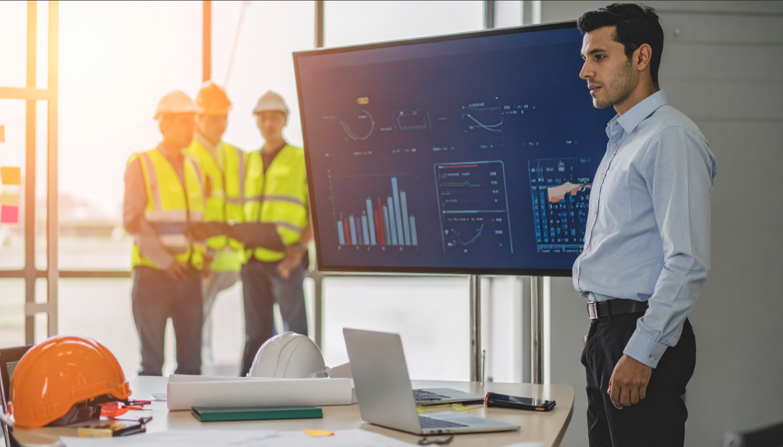 Team analyzing EHS software dashboard to improve workplace safety